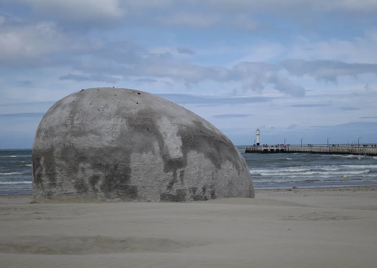 Beach with art sculpture on Belgian coast near Zeebrugge