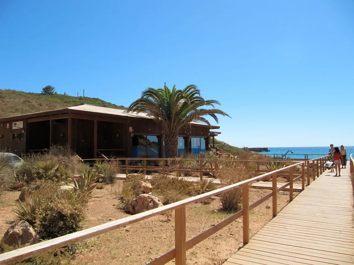 Praia das Furnas beach with caves carved into limestone cliffs near Figueira, Vila do Bispo, Algarve